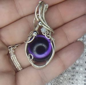 Purple cabachon wire wrapped pendant.
